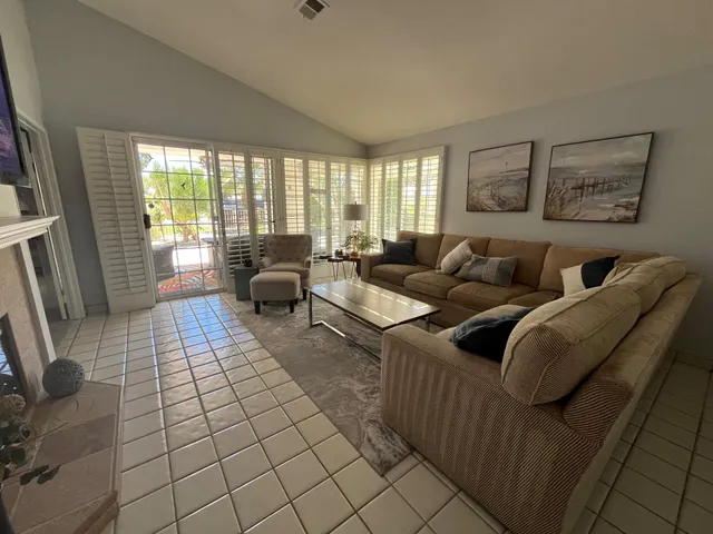 a living room with furniture and a rug