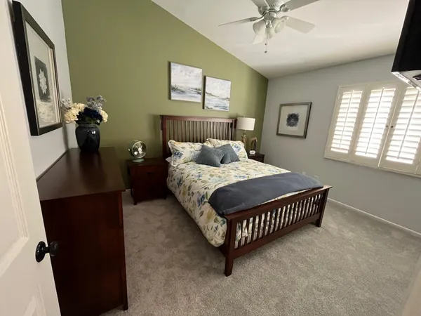 a bedroom with a bed and window