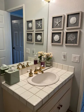a dining room with wooden floor and large windows