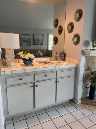 a view of a kitchen with a sink and cabinets