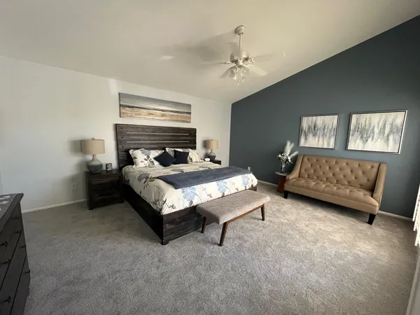 a bed room with a bed furniture and a tv