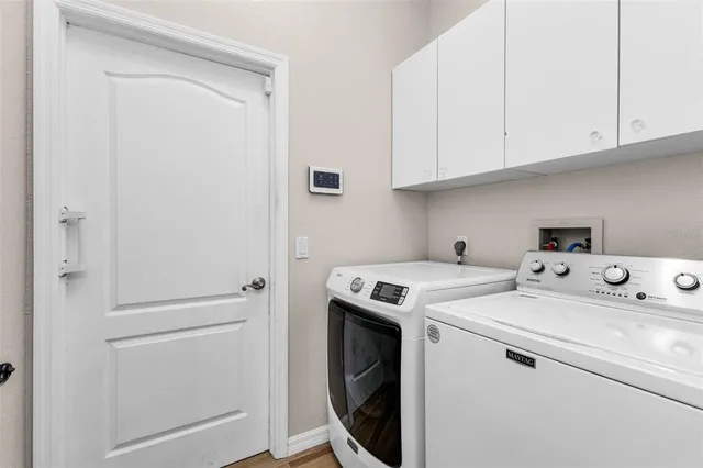 a utility room with dryer and washer