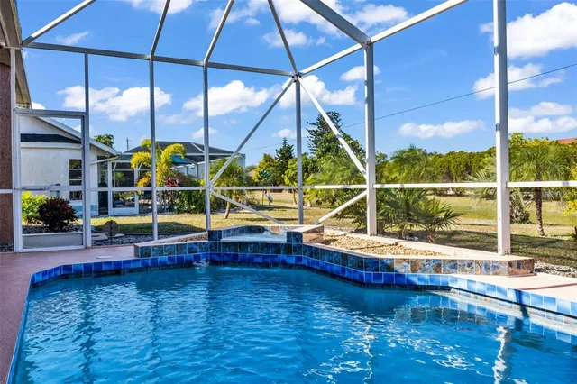 a view of a swimming pool with a lounge chairs