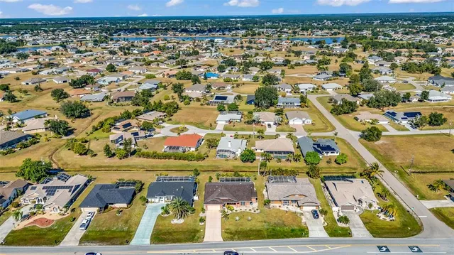 an aerial view of residential houses with outdoor space