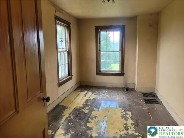 an empty room with windows