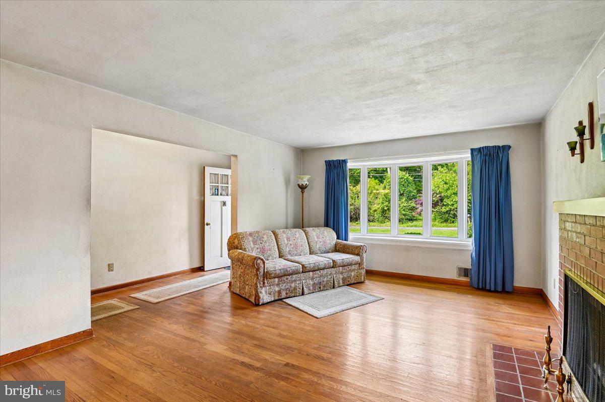 1509 Duvall Road Annapolis, MD 21409 - Photo 17 of 39 a living room with furniture and a large window