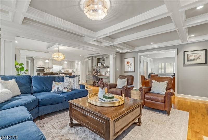 49 Hilltop Road Short Hills, NJ 07078 - Photo 14 of 34 a living room with furniture and a chandelier