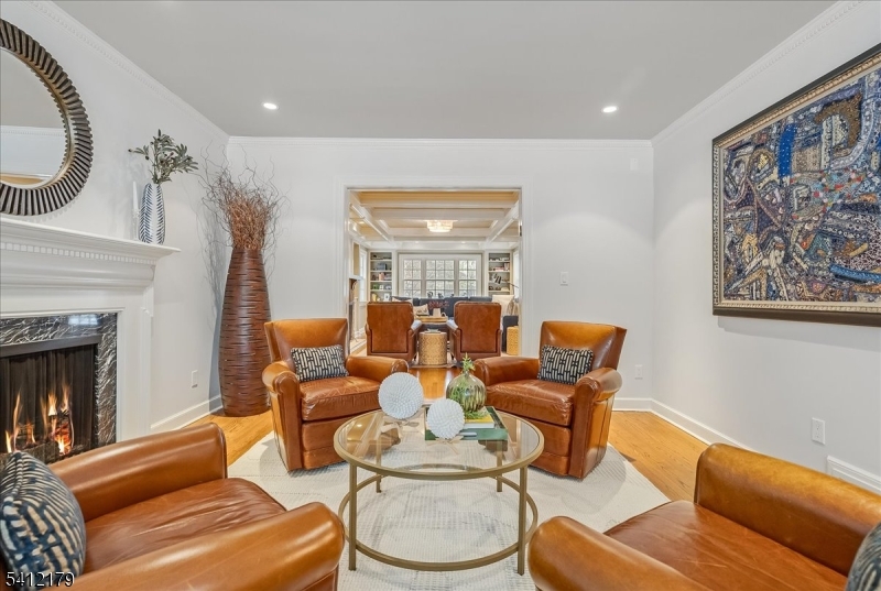 49 Hilltop Road Short Hills, NJ 07078 - Photo 17 of 34 a living room with furniture and a fireplace