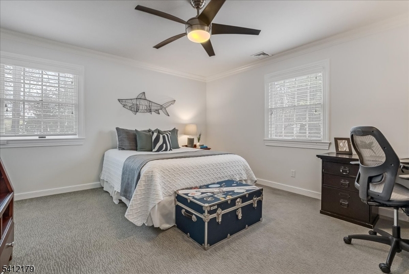 49 Hilltop Road Short Hills, NJ 07078 - Photo 25 of 34 a bedroom with a bed chair and window