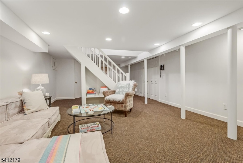 49 Hilltop Road Short Hills, NJ 07078 - Photo 30 of 34 a living room with furniture and white walls