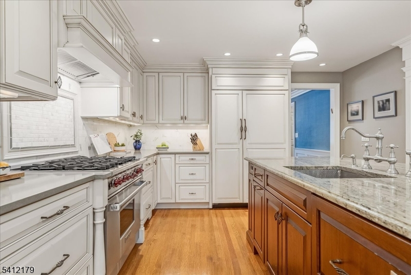 49 Hilltop Road Short Hills, NJ 07078 - Photo 6 of 34 a kitchen with granite countertop a sink stainless steel appliances and cabinets