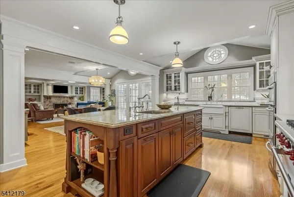 a kitchen with stainless steel appliances granite countertop a sink and cabinets