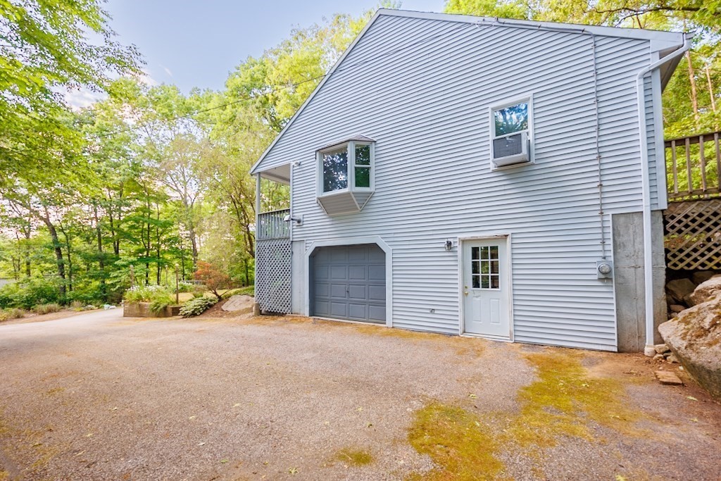 571 Douglas Road Northbridge, MA 01588 - Photo 26 of 29 a view of a house with a yard and garage