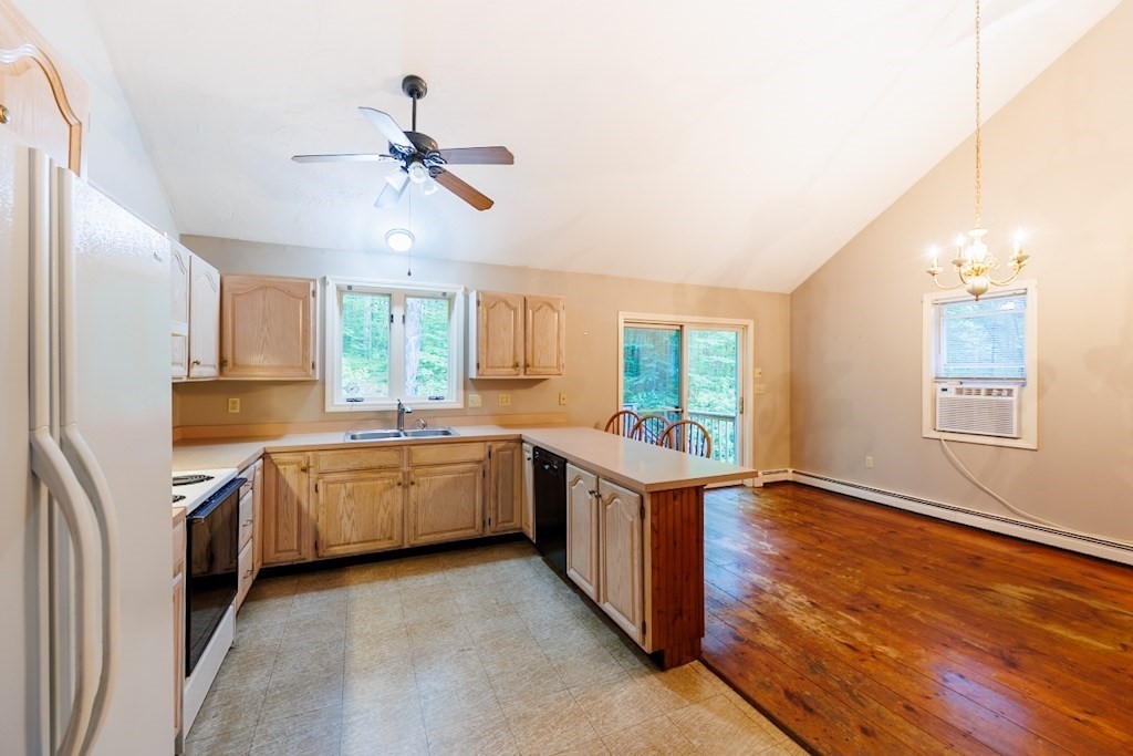 571 Douglas Road Northbridge, MA 01588 - Photo 7 of 29 a kitchen with stainless steel appliances granite countertop a stove oven and a refrigerator
