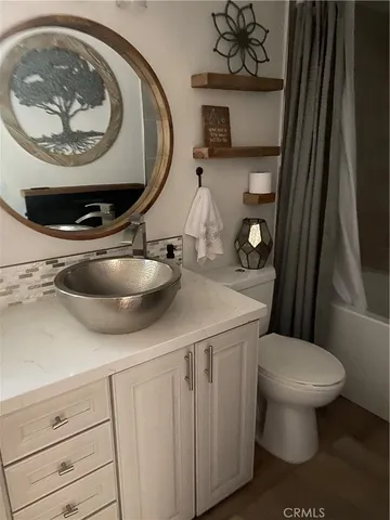 a bedroom with a bed and dresser