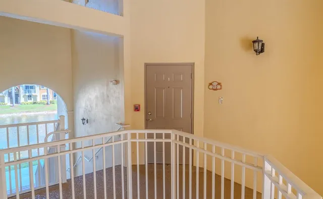 a view of a hallway with a door