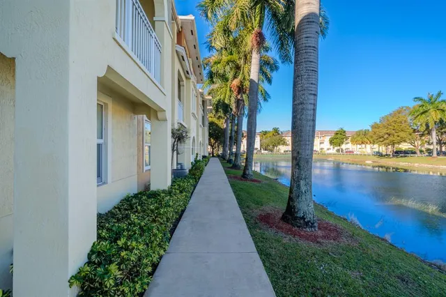 a view of a pathway both side of the house