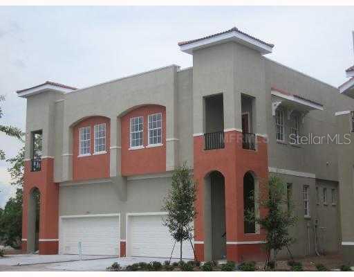 6504 Quiet Pool Court, Unit 5 Apollo Beach, FL 33572 - Photo 1 of 1 a front view of a house with a yard