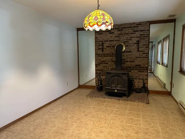 a view of a fireplace with a chandelier