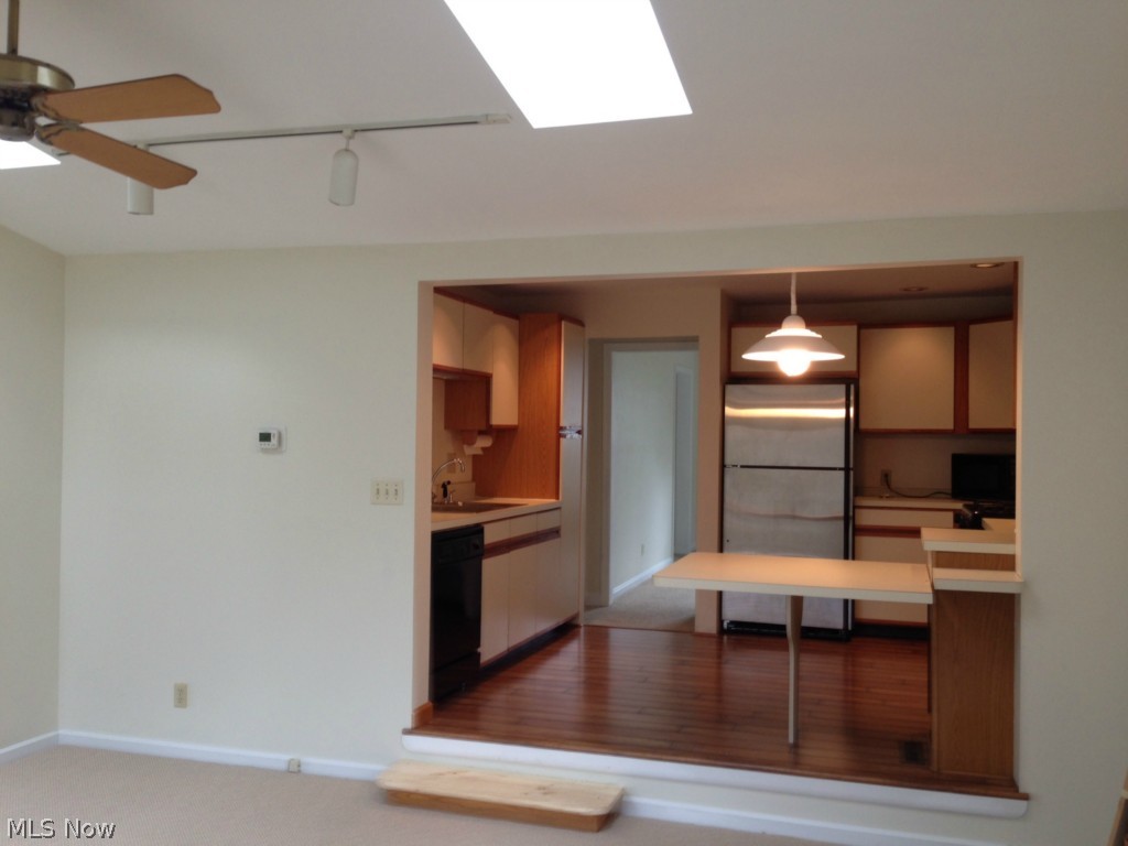 116 Callahan Road Canfield, OH 44406 - Photo 3 of 9 Great Room with Skylights opens to Kitchen with eat in counter.