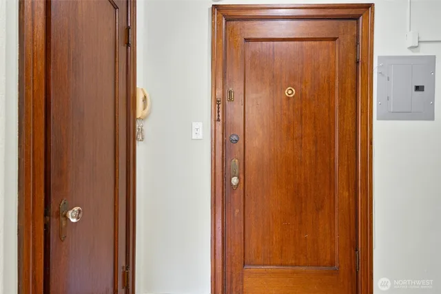 a view of a hallway with wooden floor