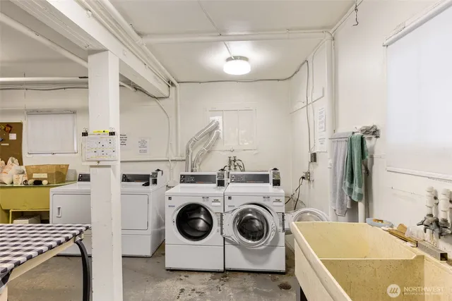 a front view of a house with plants and garden