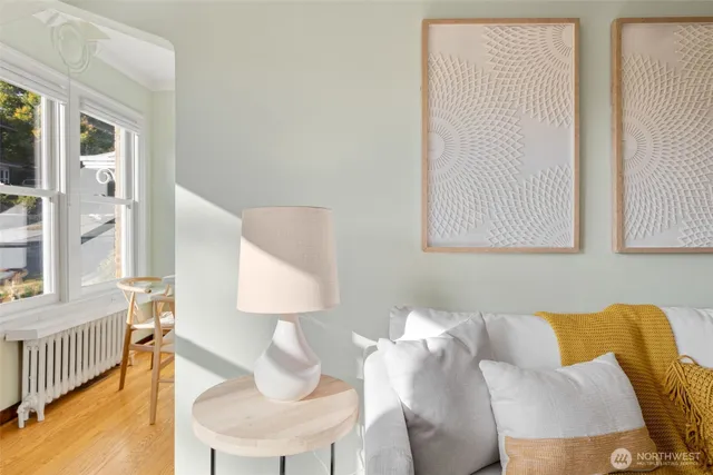 a living room with furniture and a lamp