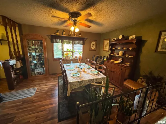 a view of a dining room with furniture and window
