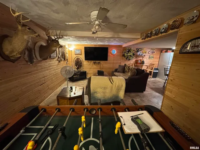 a living room with lots of furniture and a flat screen tv