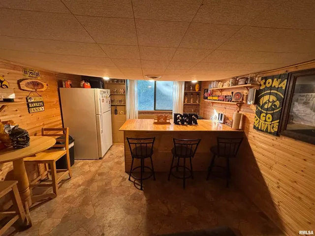 a view of a patio with dining table and chairs