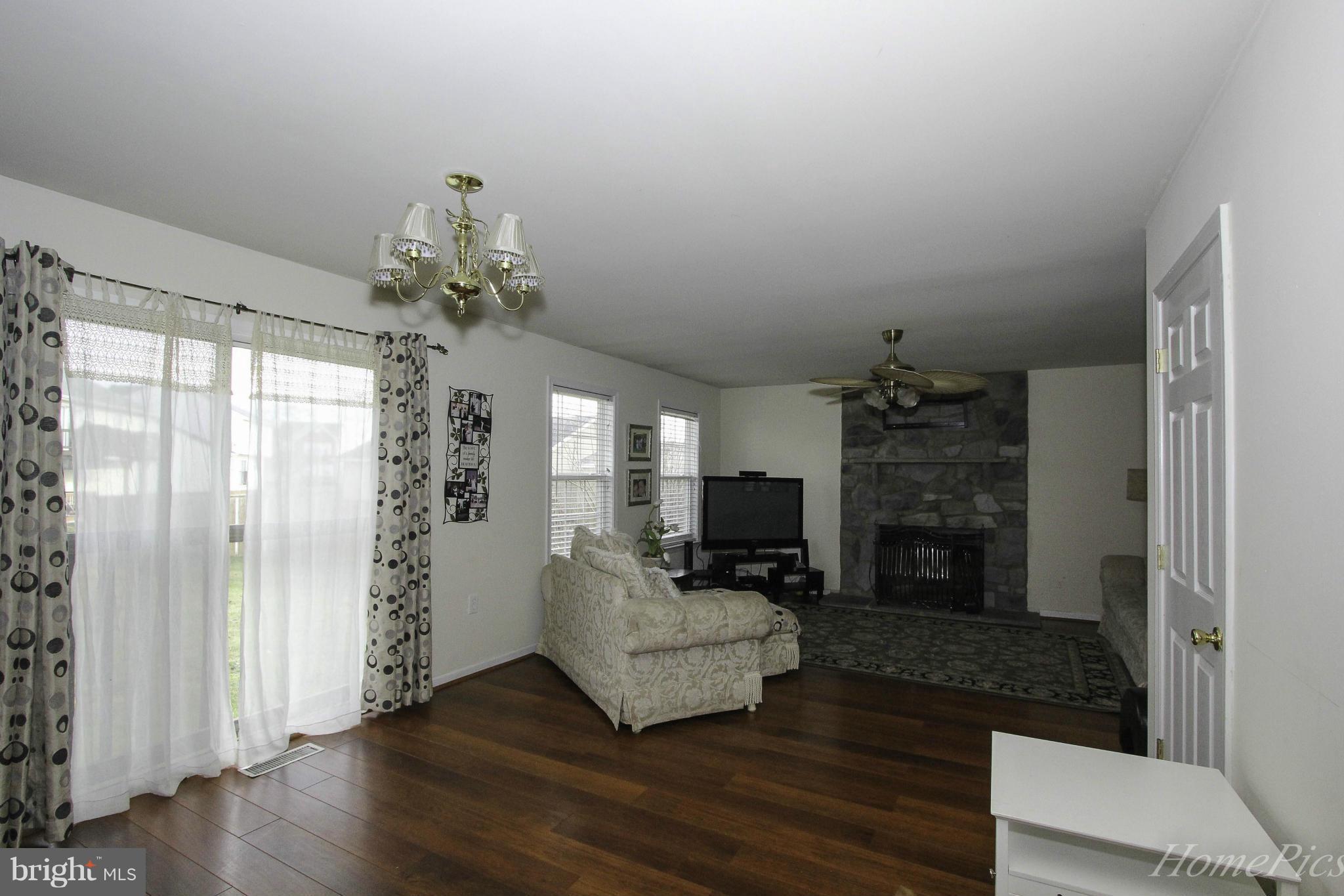 109 Limited Drive Ranson, WV 25438 - Photo 11 of 29 a living room with furniture and a fireplace