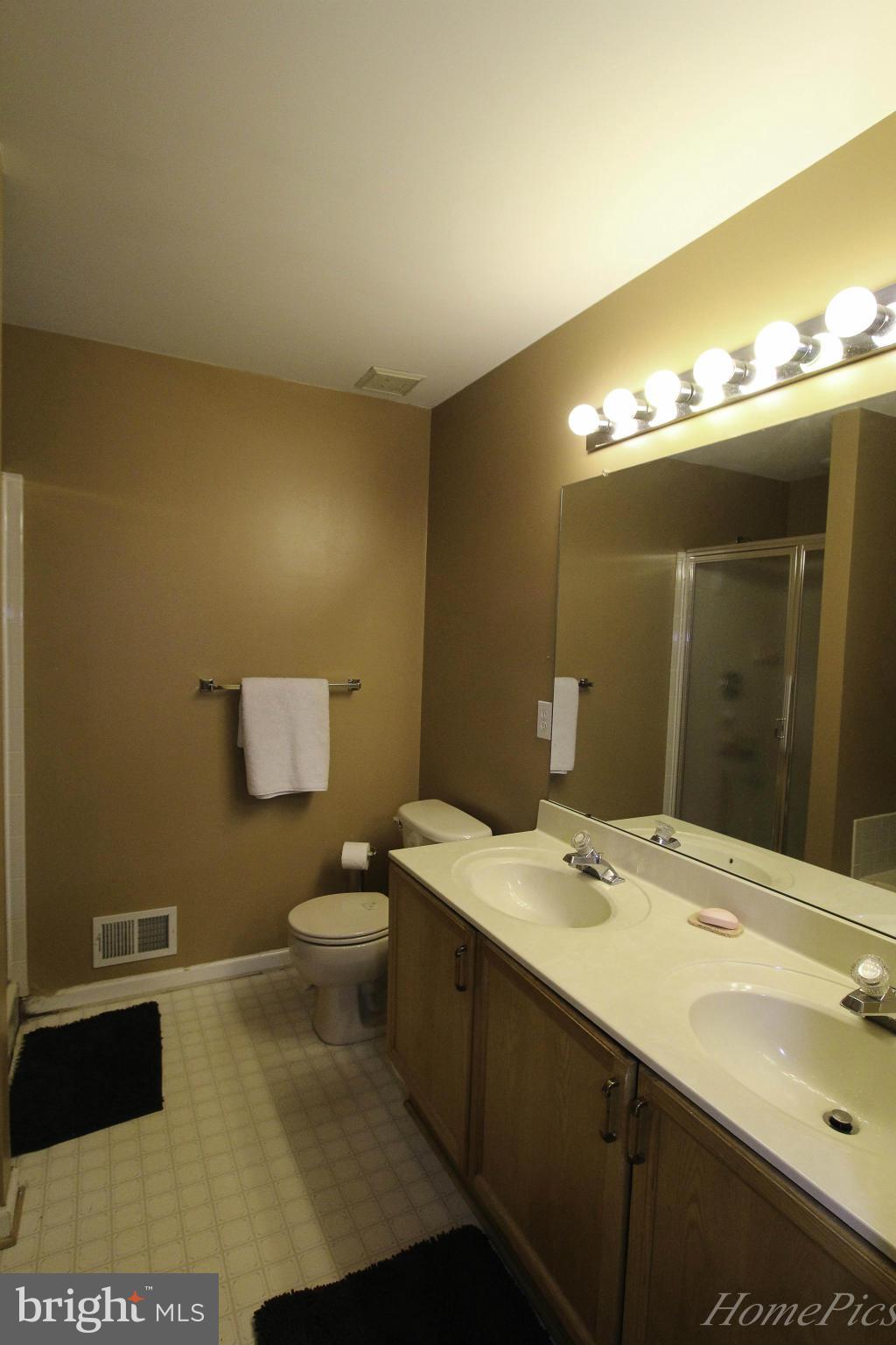 109 Limited Drive Ranson, WV 25438 - Photo 20 of 29 a bathroom with a sink and a mirror