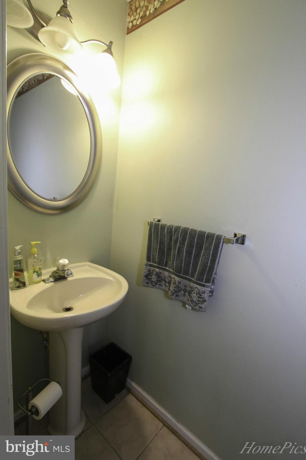 109 Limited Drive Ranson, WV 25438 - Photo 22 of 29 a bathroom with a sink and a mirror