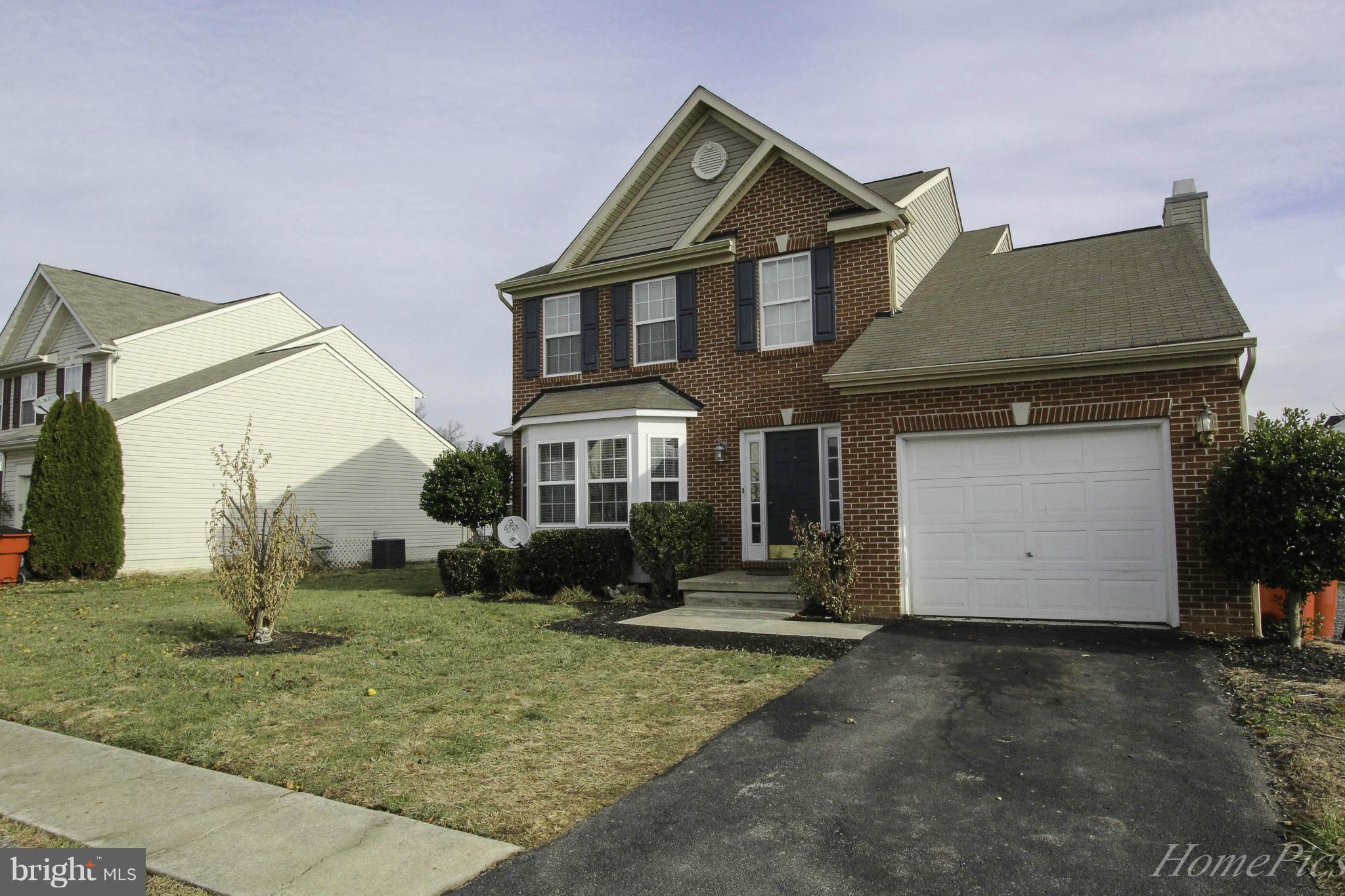 109 Limited Drive Ranson, WV 25438 - Photo 27 of 29 a front view of a house with a yard