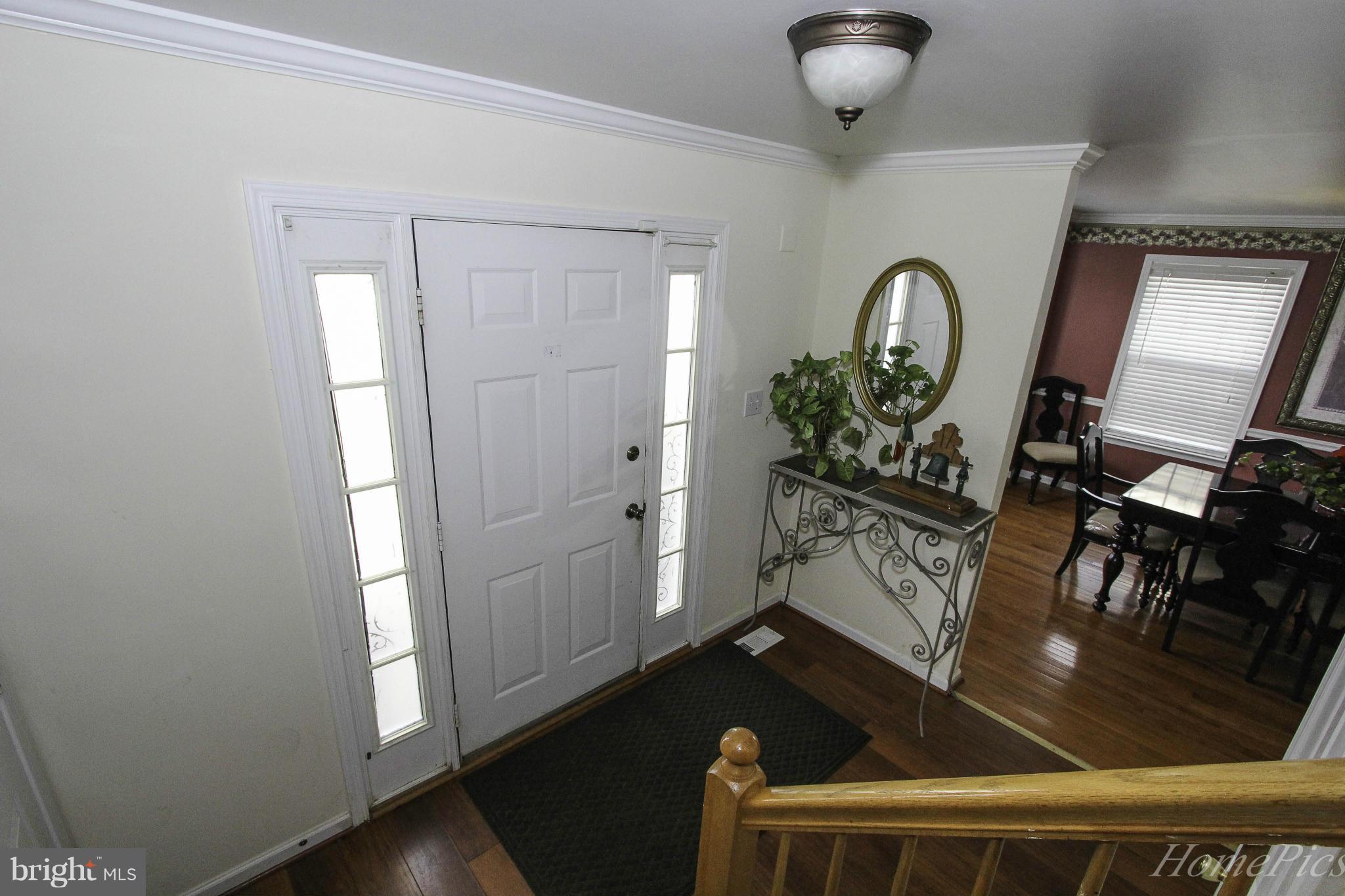 109 Limited Drive Ranson, WV 25438 - Photo 5 of 29 a view of an entryway with wooden floor