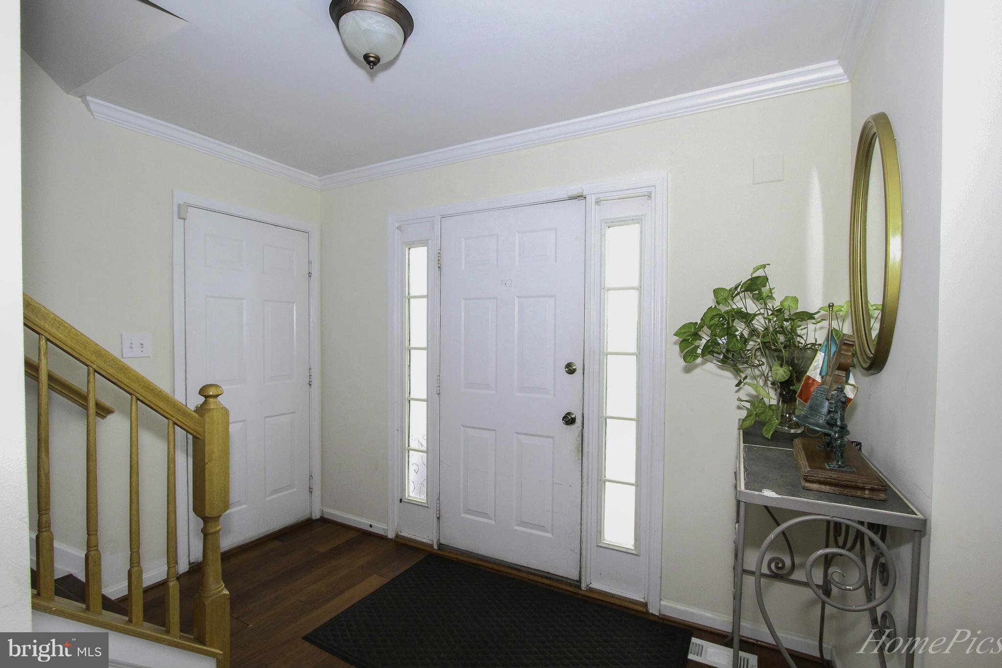 109 Limited Drive Ranson, WV 25438 - Photo 6 of 29 a view of entryway with wooden floor