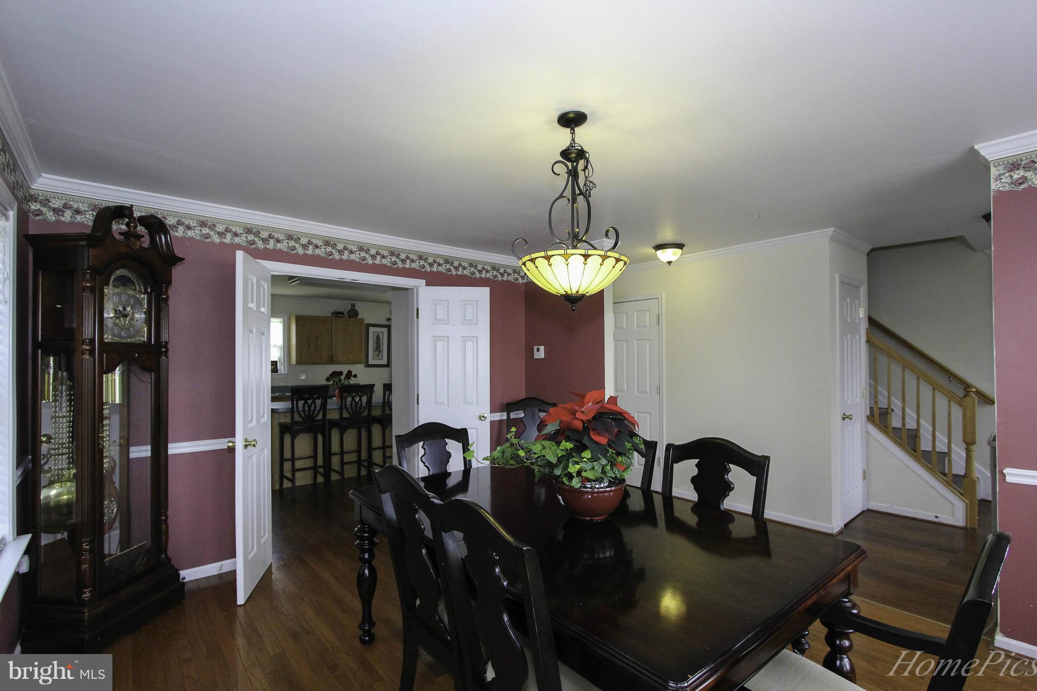 109 Limited Drive Ranson, WV 25438 - Photo 8 of 29 a view of a dining room with furniture and wooden floor