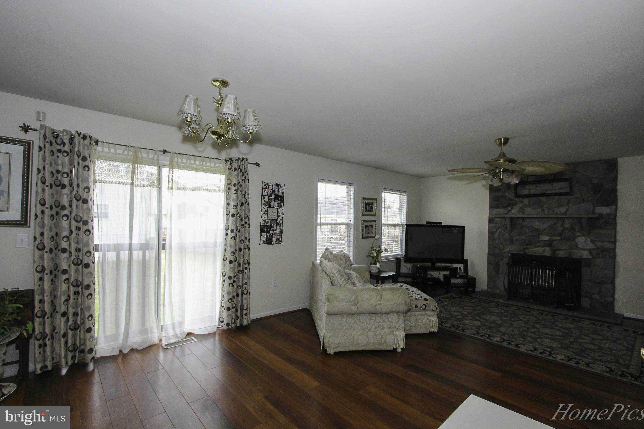 109 Limited Drive Ranson, WV 25438 - Photo 9 of 29 a living room with furniture and a fireplace