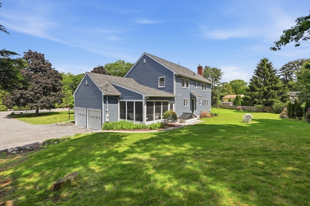 94 Johnson Road Winchester, MA 01890 - Photo 36 of 40 a front view of a house with garden and porch