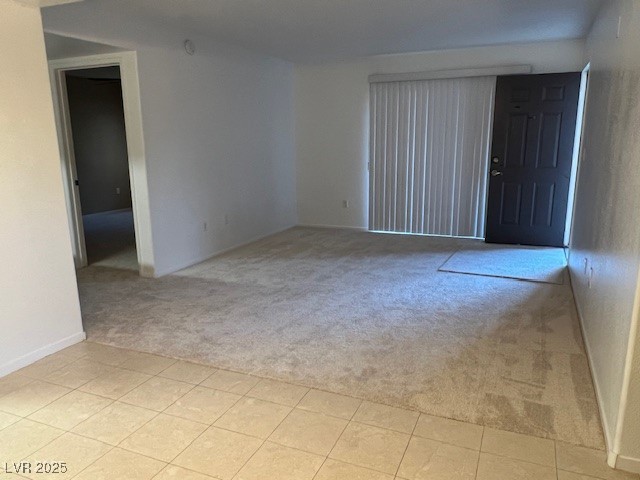 7885 West Flamingo Road, Unit 1064 Las Vegas, NV 89147 - Photo 7 of 19 Spare room with baseboards and light colored carpet