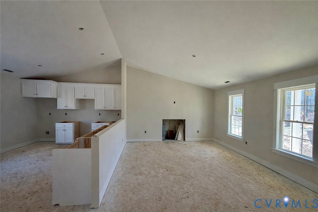 5081 Nomini Hall Road Hague, VA 22469 - Photo 6 of 22 a large white kitchen with stainless steel appliances a large counter top a stove and a refrigerator