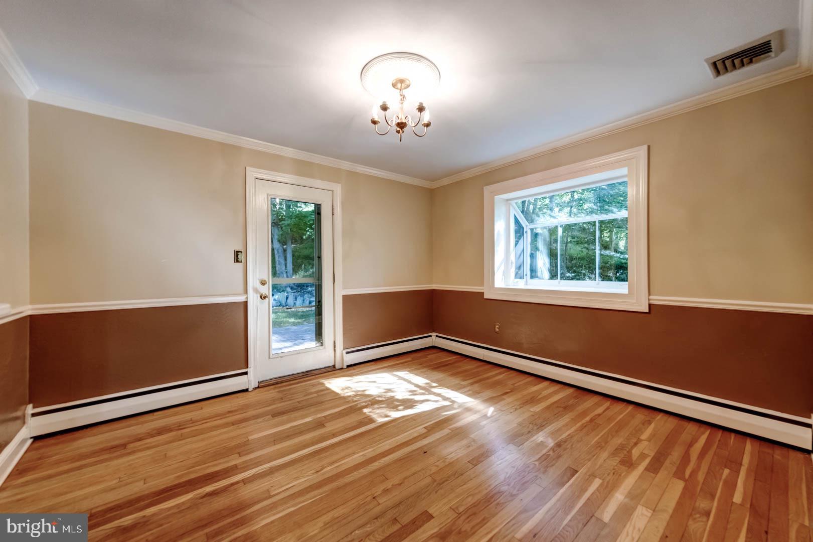 5 Walnut Lane Berwyn, PA 19312 - Photo 11 of 30 a view of an empty room with wooden floor and a window