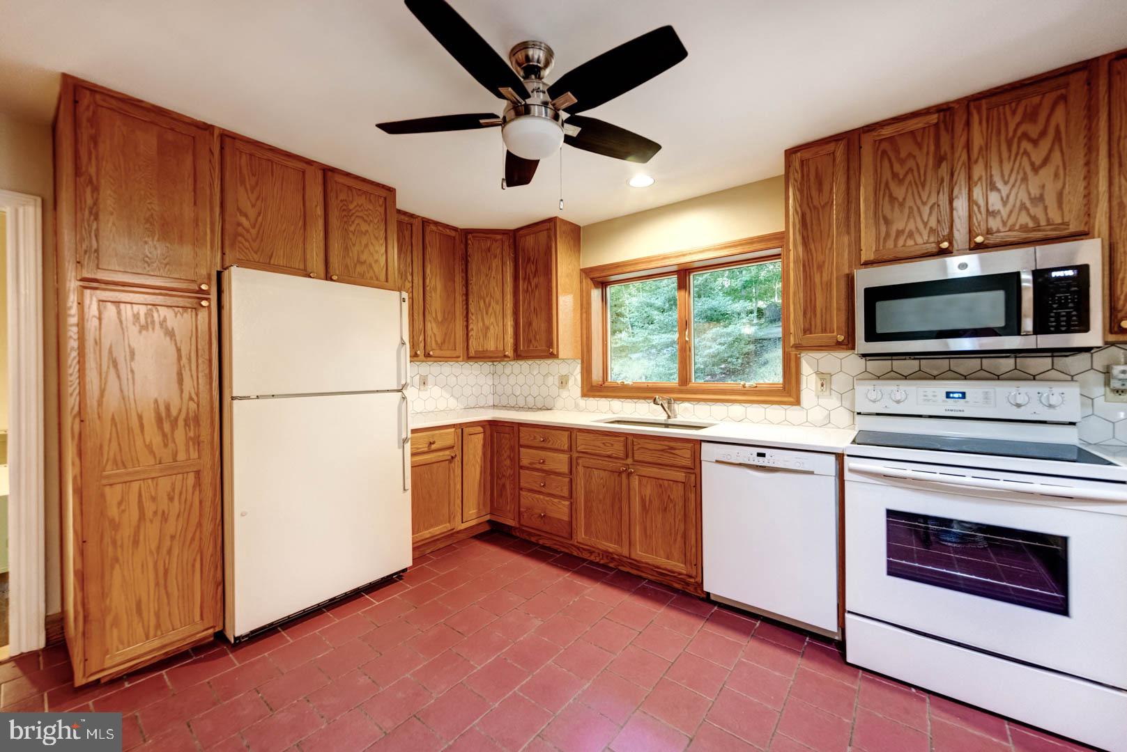 5 Walnut Lane Berwyn, PA 19312 - Photo 15 of 30 a kitchen with granite countertop a refrigerator stove top oven and sink