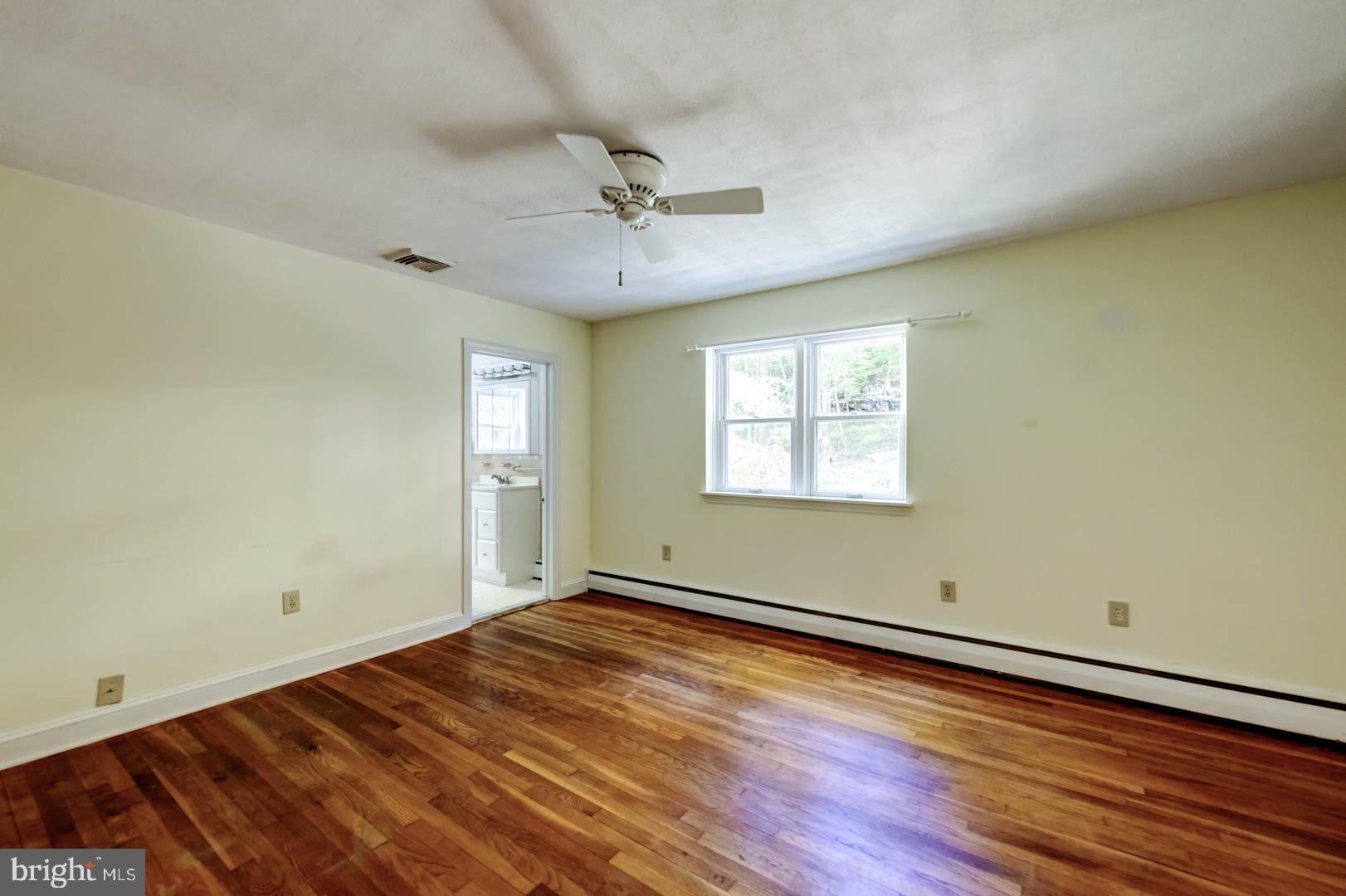 5 Walnut Lane Berwyn, PA 19312 - Photo 16 of 30 a view of empty room with wooden floor and fan