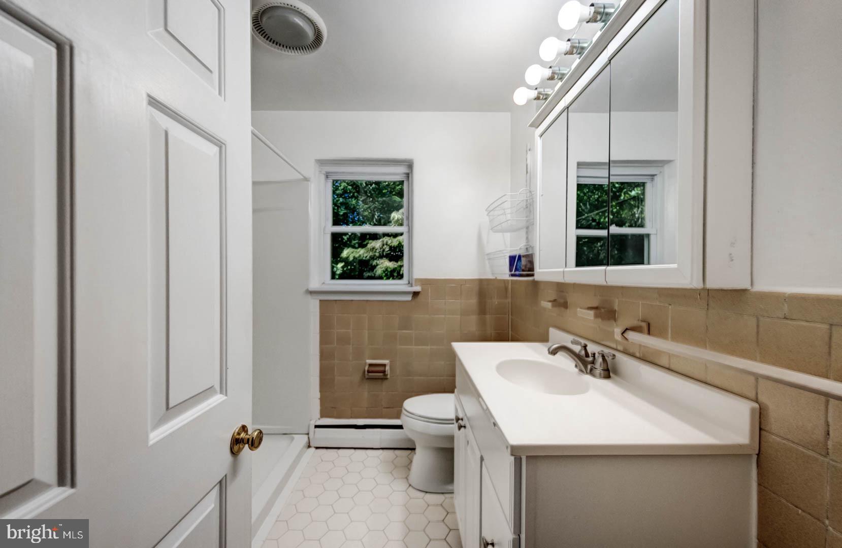 5 Walnut Lane Berwyn, PA 19312 - Photo 18 of 30 a bathroom with a sink a toilet and a mirror