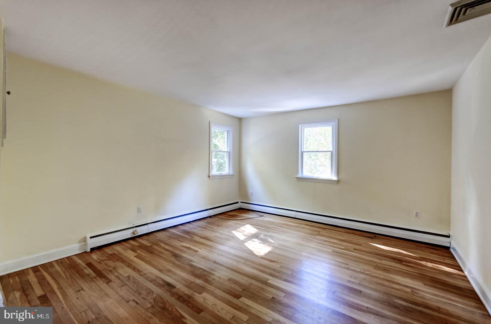 5 Walnut Lane Berwyn, PA 19312 - Photo 19 of 30 an empty room with wooden floor and windows