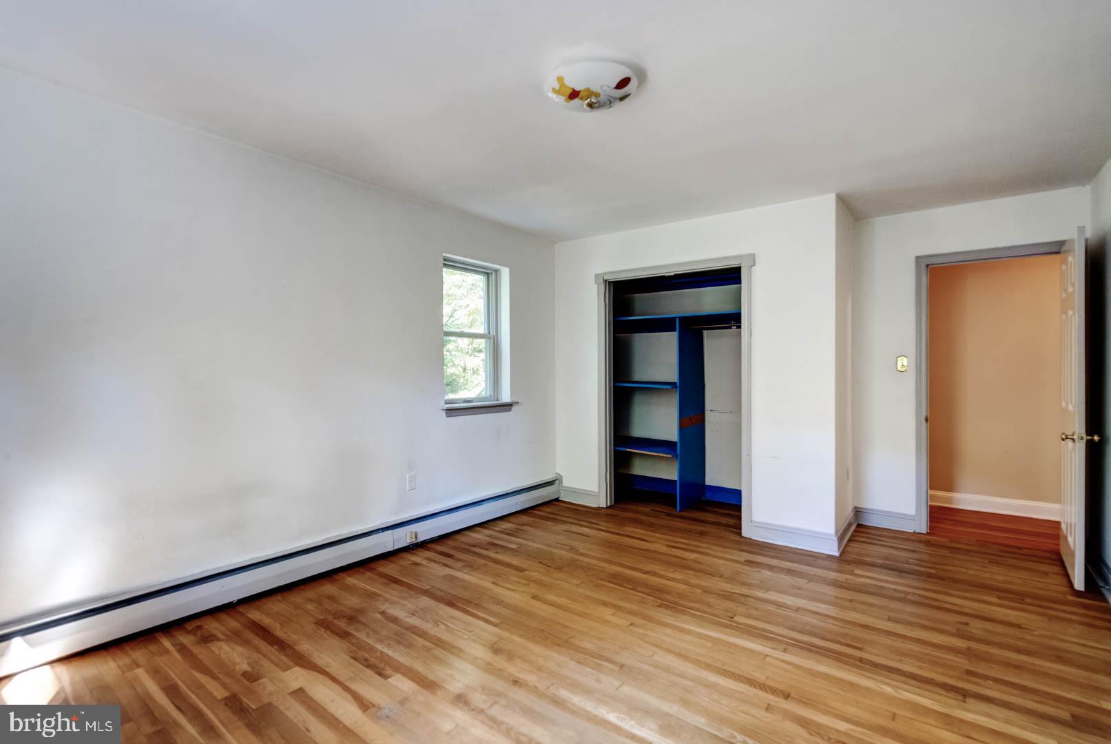 5 Walnut Lane Berwyn, PA 19312 - Photo 22 of 30 an empty room with wooden floor and windows