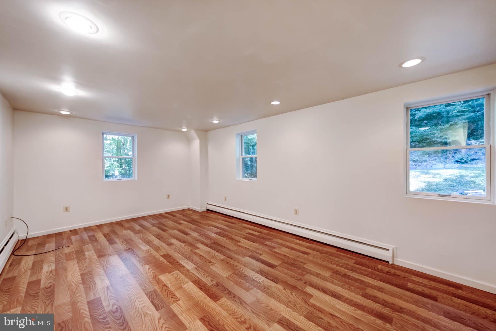 5 Walnut Lane Berwyn, PA 19312 - Photo 24 of 30 an empty room with wooden floor and windows