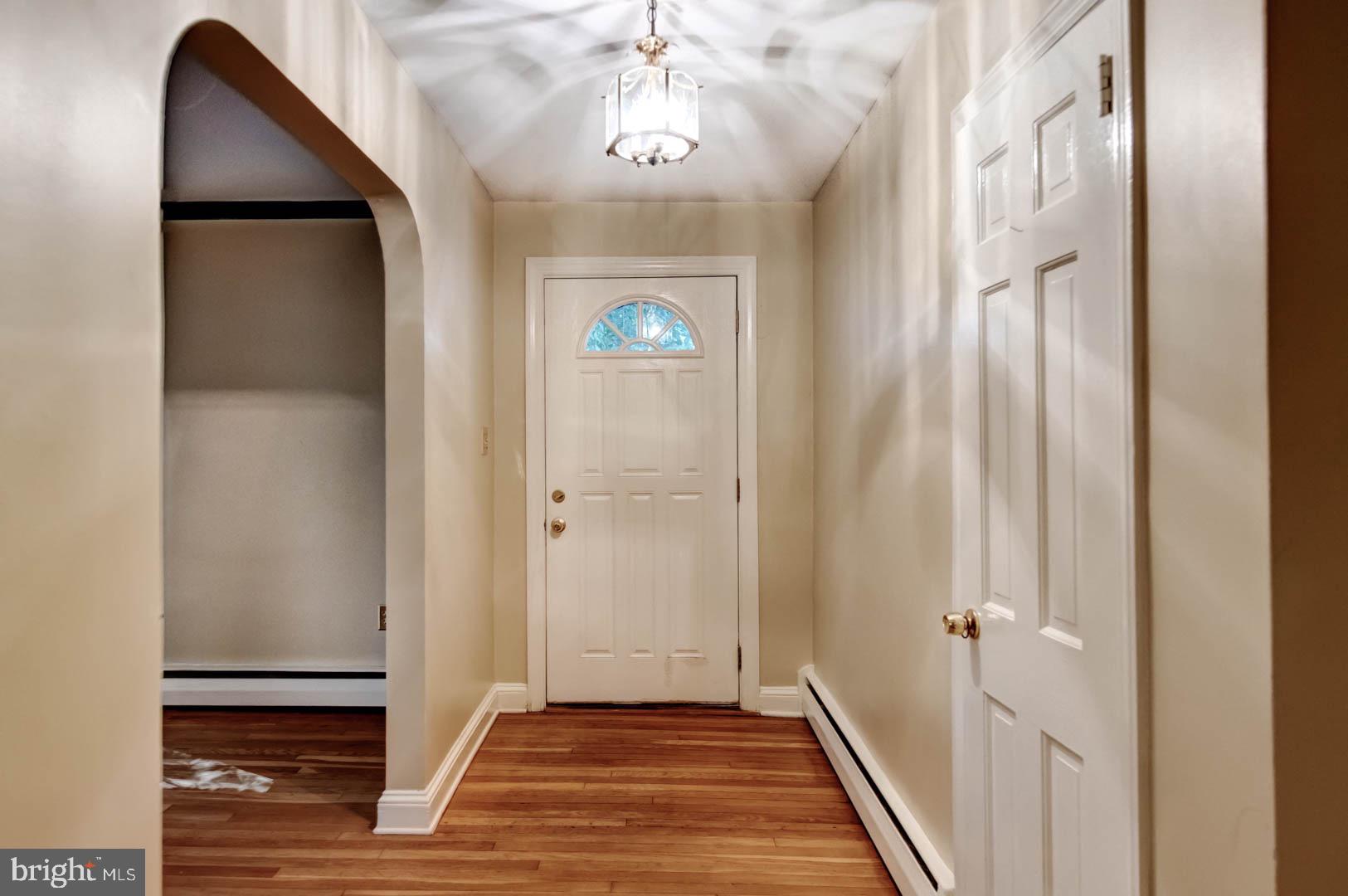 5 Walnut Lane Berwyn, PA 19312 - Photo 4 of 30 a view of a hallway to a bedroom with wooden floor