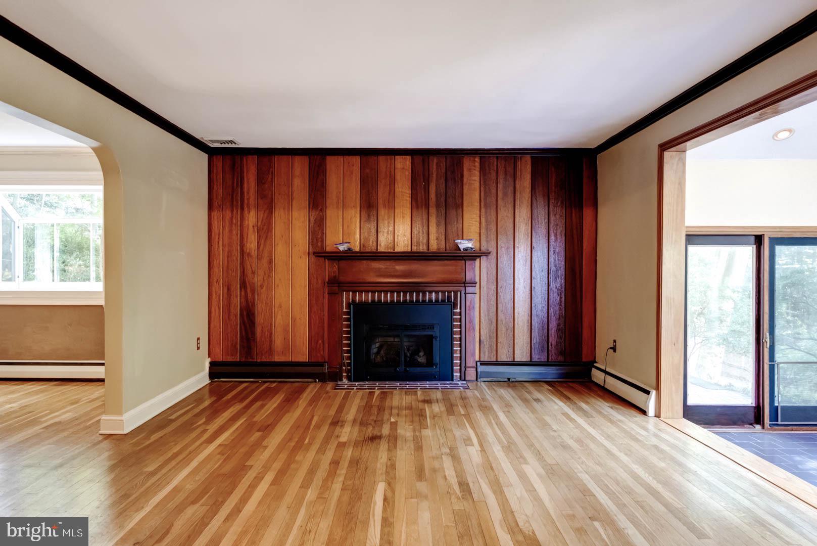 5 Walnut Lane Berwyn, PA 19312 - Photo 5 of 30 wooden floor fireplace and windows in an empty room